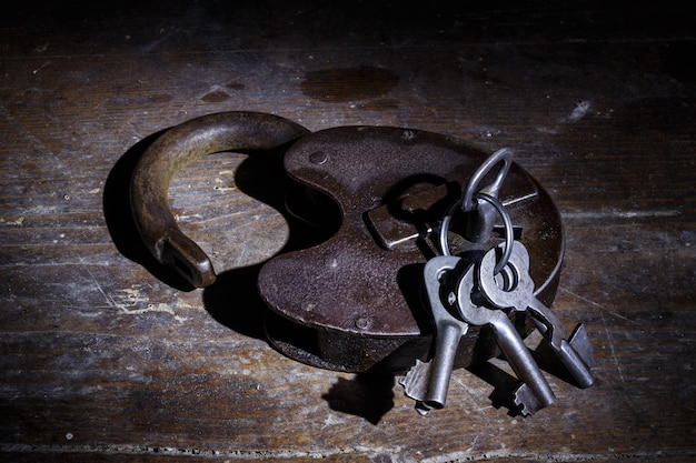 Old lock with keys in the dark