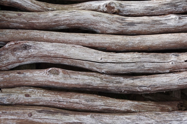 Old logs. Old wooden bridge. Wooden texture, background. Closeup