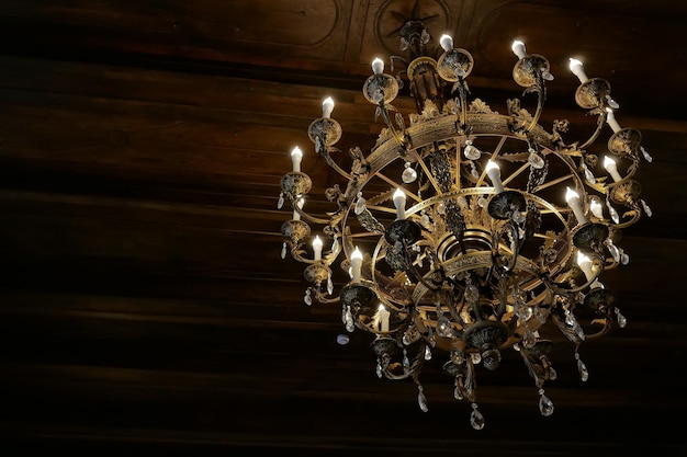 Old luxury gold chandelier on the ceiling