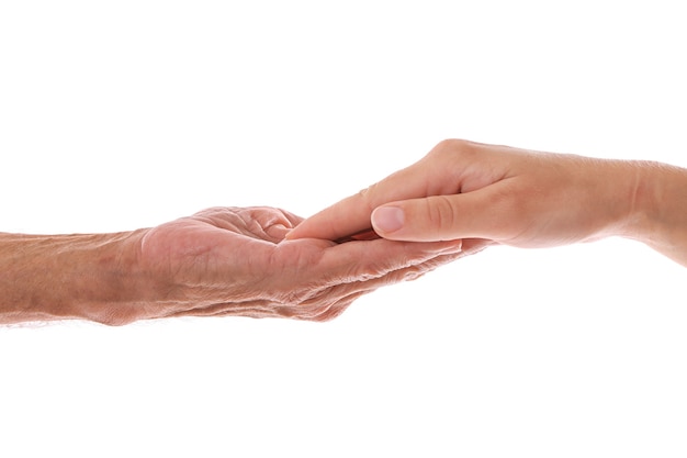 Old male and young female hands on white background