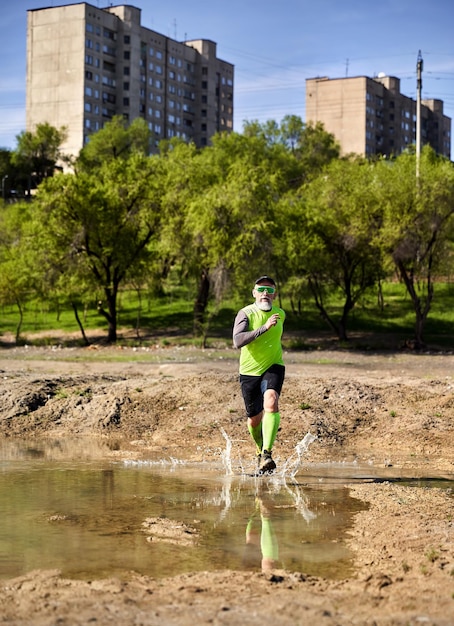 Old man running in the park