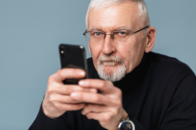 Old man using phone portrait