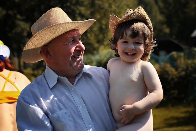 Old man with child in hat