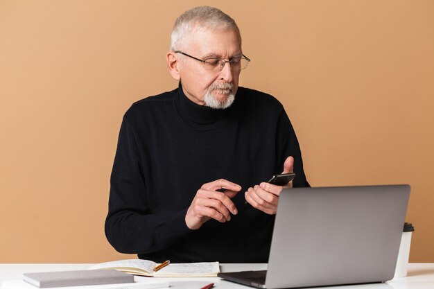 Old man with laptop portrait