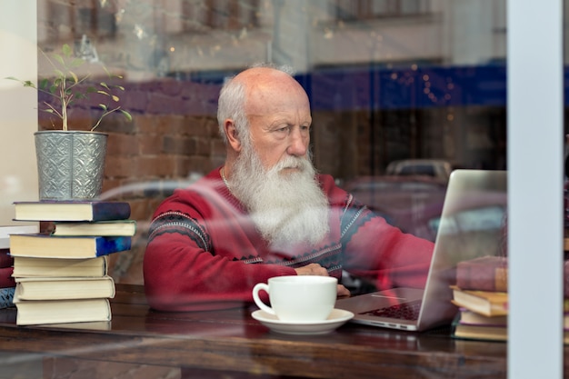 Old man with a laptop