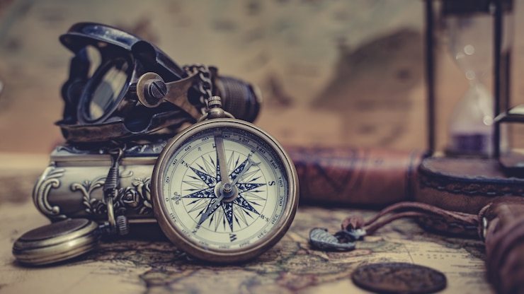 Photo old map with compass necklace