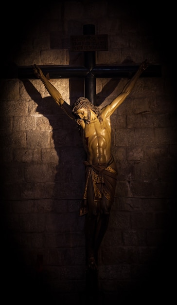 Old medieval crucifix in Italian church - made of wood