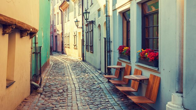 Old medieval narrow street in Riga Latvia Retro styled