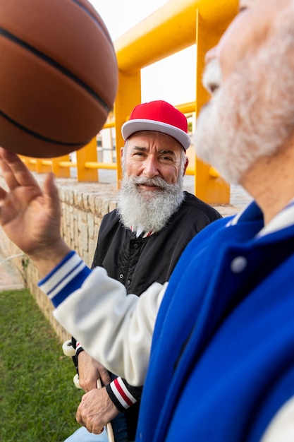 Old men wearing varsity jacket outdoors