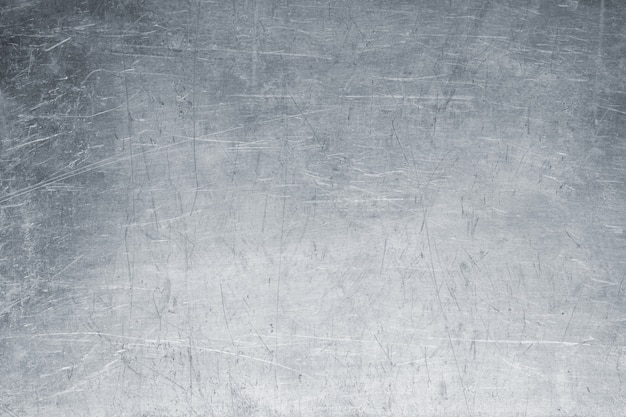 Photo old metal background, bright iron texture, worn brush or sandpap