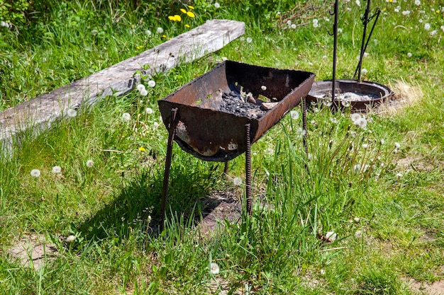 Old metal barbecue grill for cooking kebabs