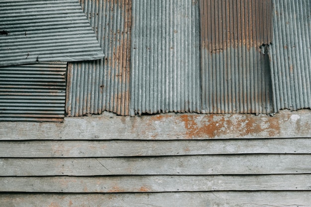 Old metal and brown wooden background