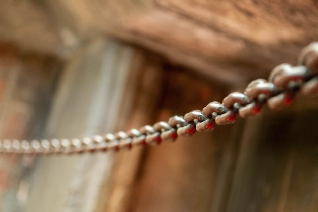 Old metal chain on water background in the sunlight