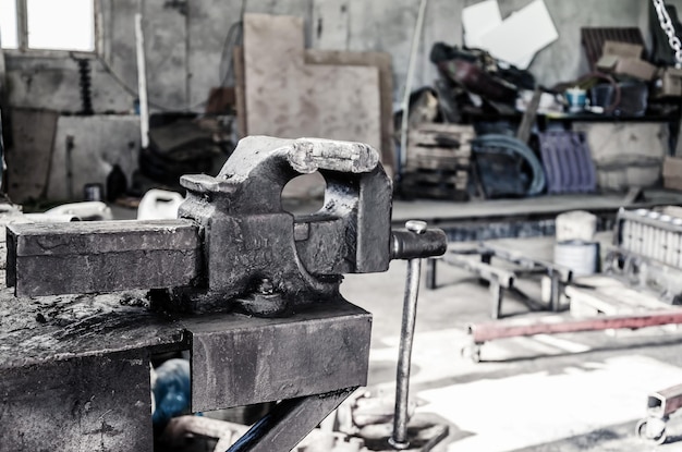 Old metal vise in the metalwork shop