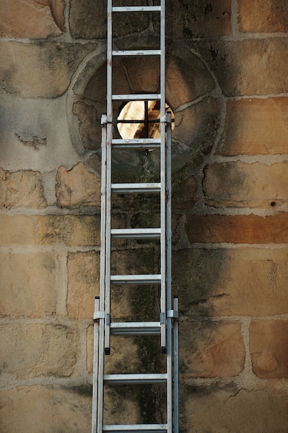 old metallic ladder on the wall in the street