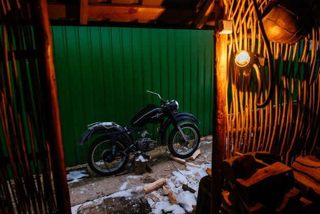 Old motorcycle seen from inside a house