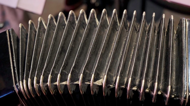 Old musical instrument Russian bayan button accordion closeup