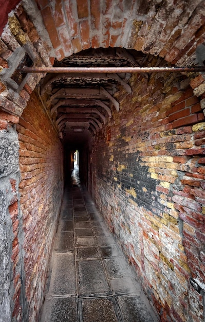 Old narrow street in Venice Italy