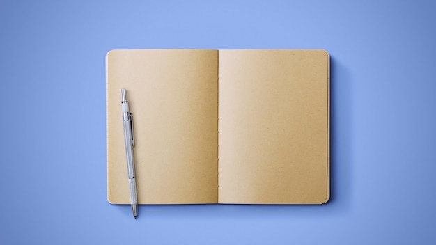 Old notebook with pen on blue background