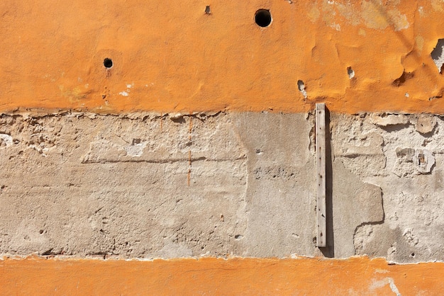 Старая оранжевая текстура стены в Пизе, Италия
