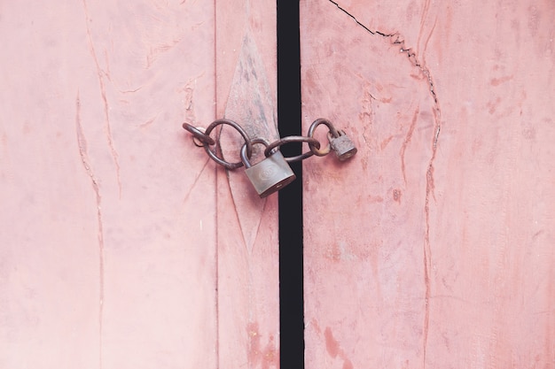 Old padlock on the wooden door