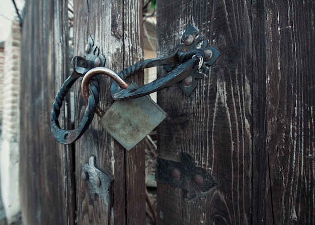 Old padlock on a wooden door