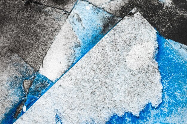 Old paint stains dirty uneven texture aged page layers black blue ink grain noise on white torn edge