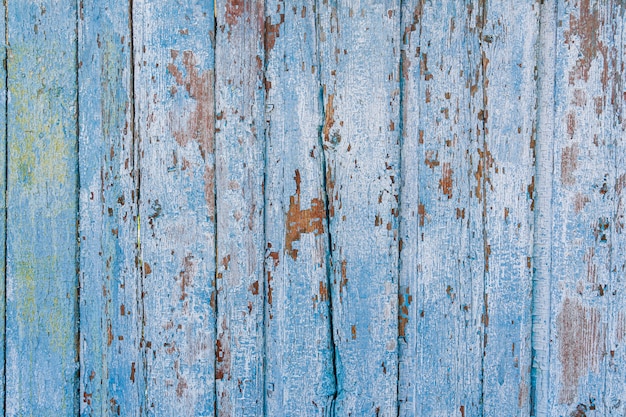 Old painted cracked boards, top view. Wood texture.