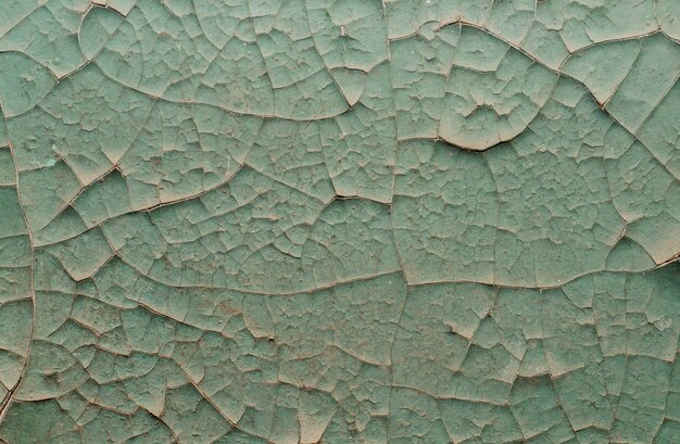 Old painted wall with cracked paint