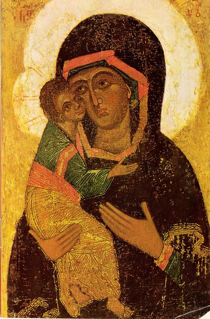 an old painting of a woman holding a child