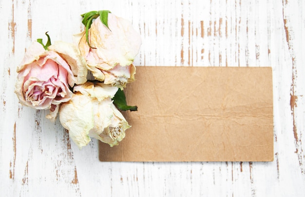 Old paper with dried roses