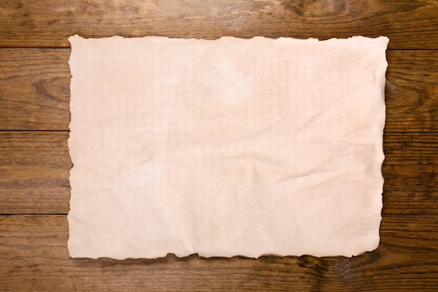 Old paper on wooden background