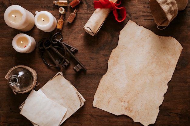 Photo old parchment and keys near candles