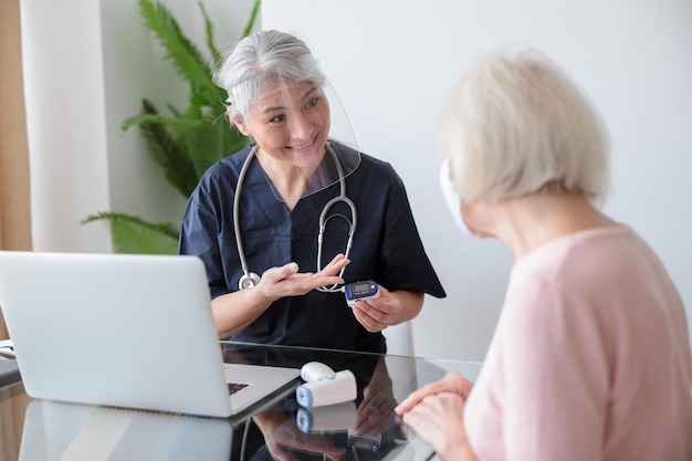 Old patient with her nurse on appointment