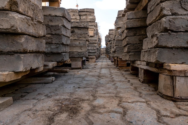 Old paving slabs in closeup Storage of paving slabs during the repair of roads and pedestrian areas Reconstruction of urban infrastructure