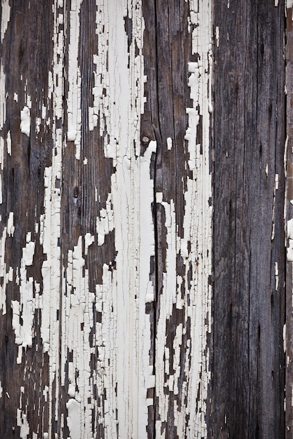 Old peeled off wooden planks surface background