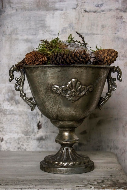 Old pewter bowl cup on the wooden table