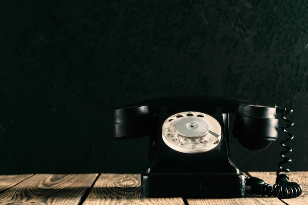 A old phone on the wood