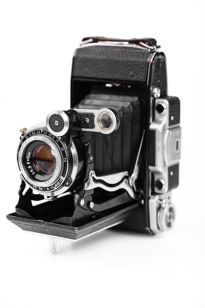 Old photo camera on a white background