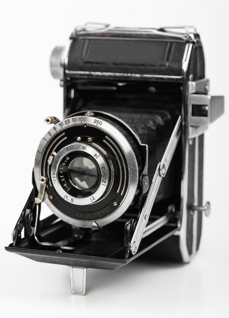 Old photo camera on a white background