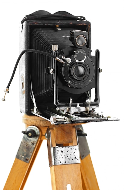 Old photo camera on a white background