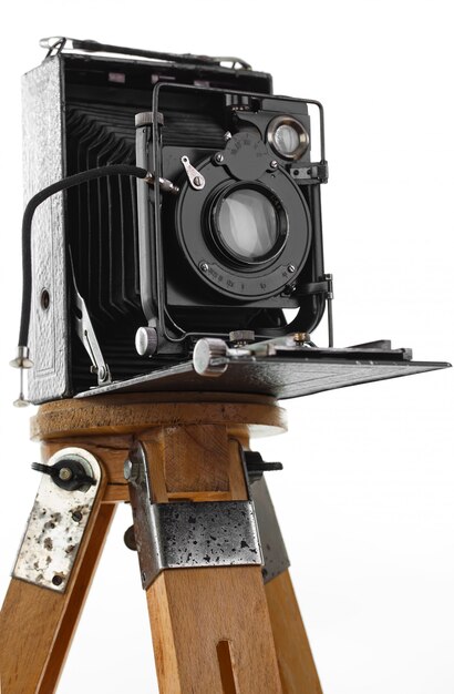 Old photo camera on a white background