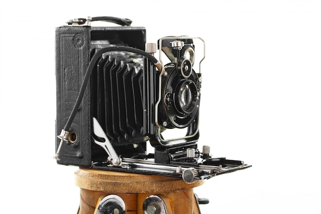 Old photo camera on a white background