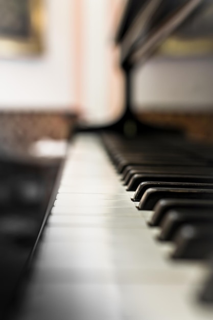 Old Piano keyboard with selective focus behind a blurred background