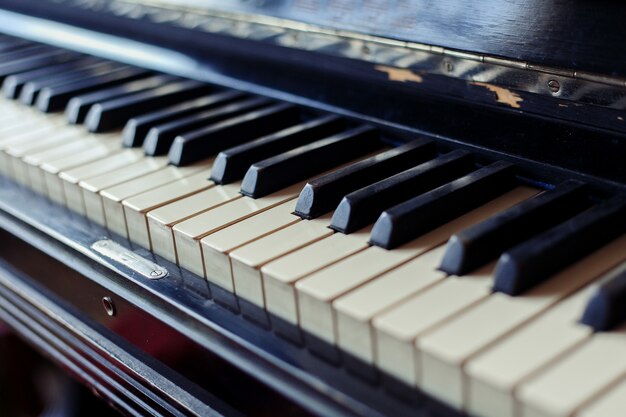 Old piano keys close up, selective focus