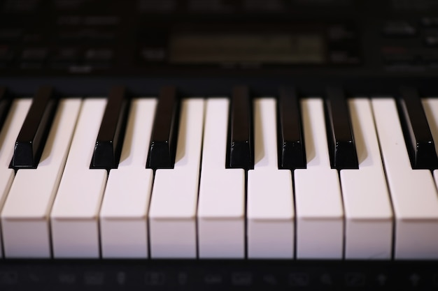 Old piano keys. close up view.effect back and white color, musical instrument background concept