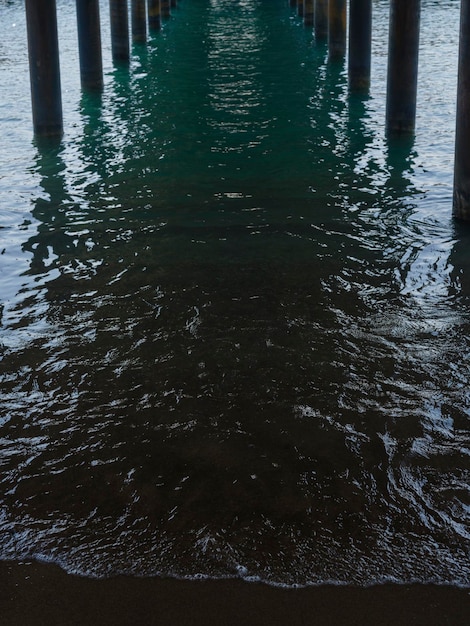 Old pier and sea waves