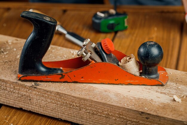 Old planer for woodworking with wood shavings