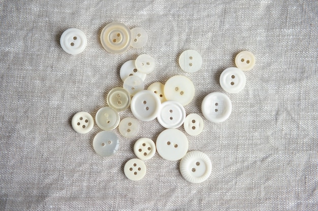 Photo old plastic buttons in different colors on the background. tinting