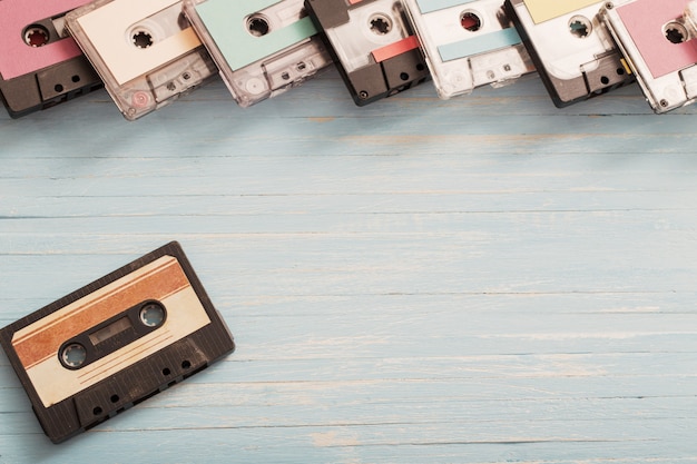 Old plastic cassette on wooden surface